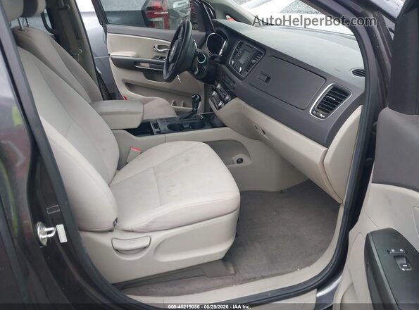 KNDMB5C1XG6099737 2016 KIA SEDONA Black Front interior view