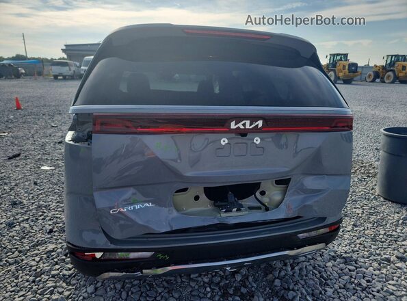 KNDNE5H30P6276091 2023 KIA CARNIVAL Серый Вид сзади
