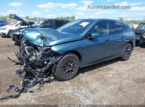 WB523CF03SCU09700 2025 BMW IX Teal Vista tres cuartos delantera izquierda