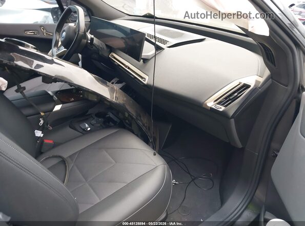 WB523CF06PCM54850 2023 BMW IX Black Widok wnętrza z przodu
