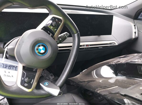 WB523CF06PCM54850 2023 BMW IX Black Widok deski rozdzielczej