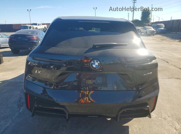 WB543CF08TCW71917 2026 BMW IX Black Вид ззаду