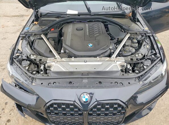 WBA13AW08RFR08311 2024 BMW M4 Black Вид задньої частини салону
