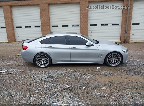WBA4J1C59KBU67384 2019 BMW 4 SERIES Silver Rear interior view