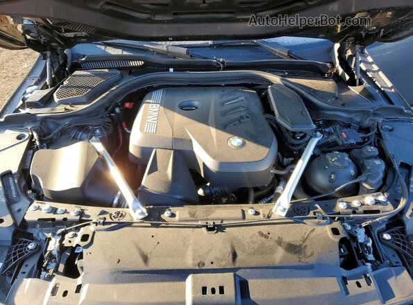 WBA53FJ04RCP81256 2024 BMW 5 SERIES Charcoal Vista interior trasera