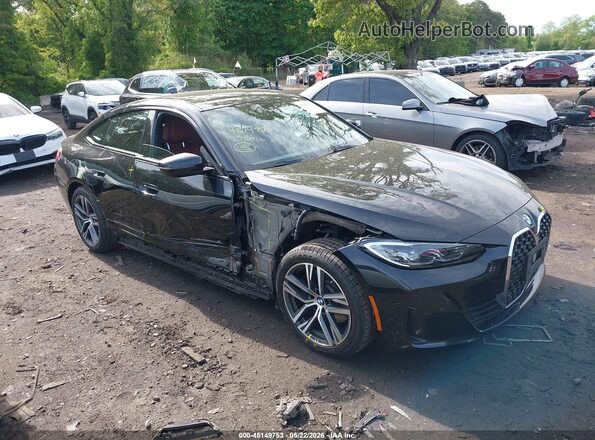 WBA73AV05PFP33301 2023 BMW 4 SERIES Черный Вид задней части салона
