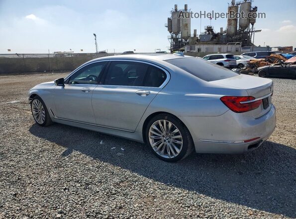 WBA7F0C52HGM21173 2017 BMW 7 SERIES Silver Tył lewy