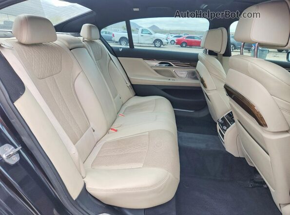 WBA7F2C52GG417229 2016 BMW 7 SERIES Charcoal Vista de los asientos traseros