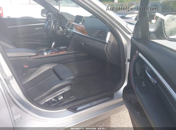 WBA8E1C58JA178605 2018 BMW 3 SERIES Silver Вид салону спереду