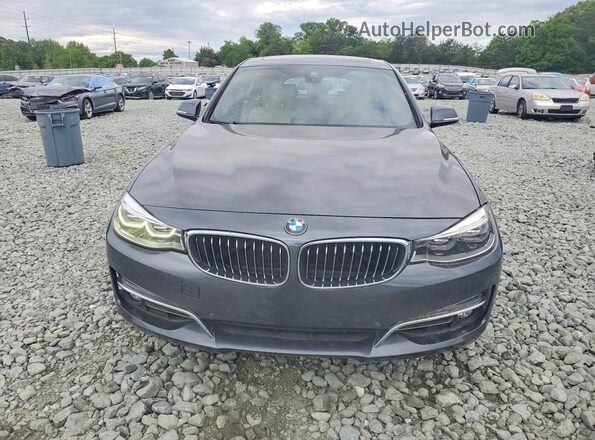 WBA8Z9C52KB220698 2019 BMW 3 SERIES Gray Front view