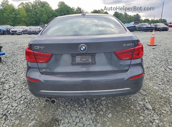 WBA8Z9C52KB220698 2019 BMW 3 SERIES Gray Rear view