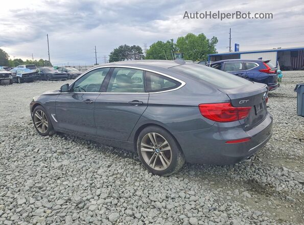 WBA8Z9C52KB220698 2019 BMW 3 SERIES Gray Rear left