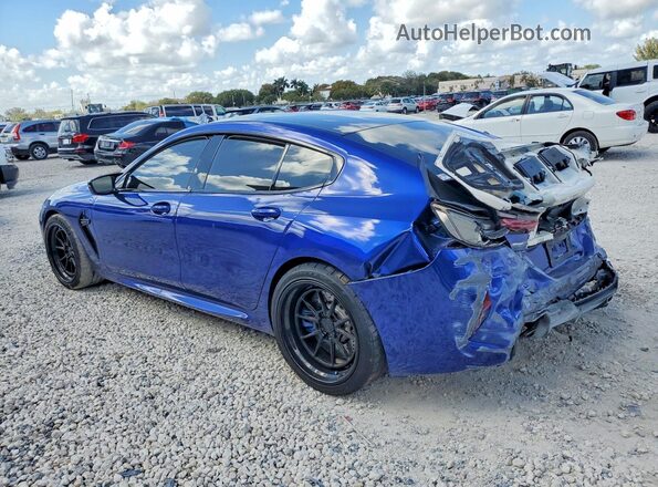 WBSGV0C09NCJ55155 2022 BMW M8 Blue Trasero izquierdo