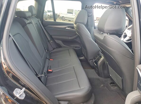 WBX57DP02RN304075 2024 BMW X3 Черный Вид задней части салона