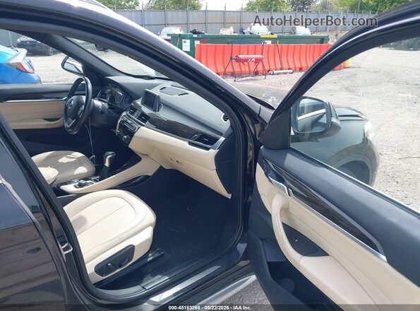 WBXHT3C32G5F63636 2016 BMW X1 Black Vista interior delantera