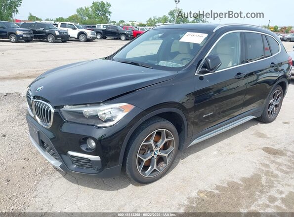 WBXHT3C32G5F63636 2016 BMW X1 Black Vista tres cuartos delantera izquierda