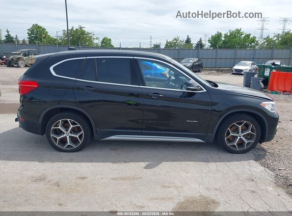 WBXHT3C32G5F63636 2016 BMW X1 Black Vista interior trasera