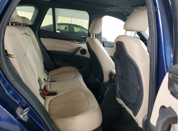 WBXHT3C33GP883260 2016 BMW X1 Blue Widok wnętrza z tyłu
