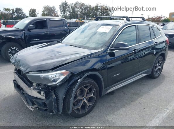 WBXHT3C34J5K22016 2018 BMW X1 Black Vista tres cuartos delantera izquierda