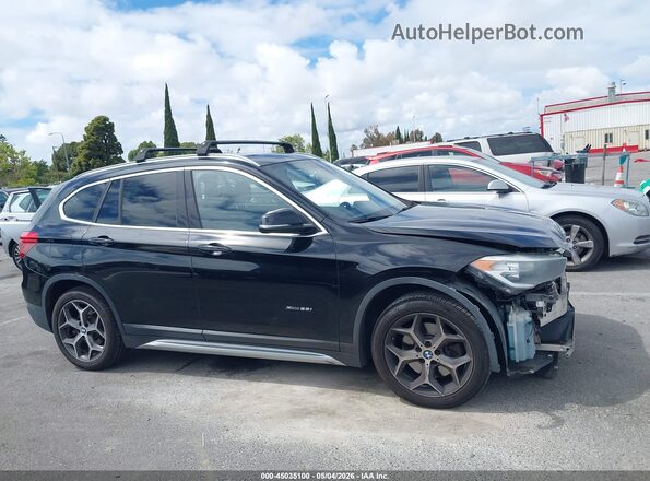 WBXHT3C34J5K22016 2018 BMW X1 Black Vista interior trasera