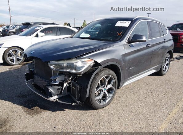 WBXHT3C35H5F73045 2017 BMW X1 Gray Front left