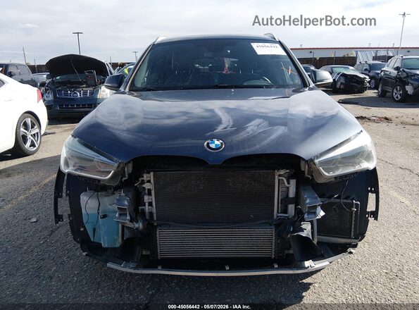 WBXHT3C35H5F73045 2017 BMW X1 Gray Rear interior view