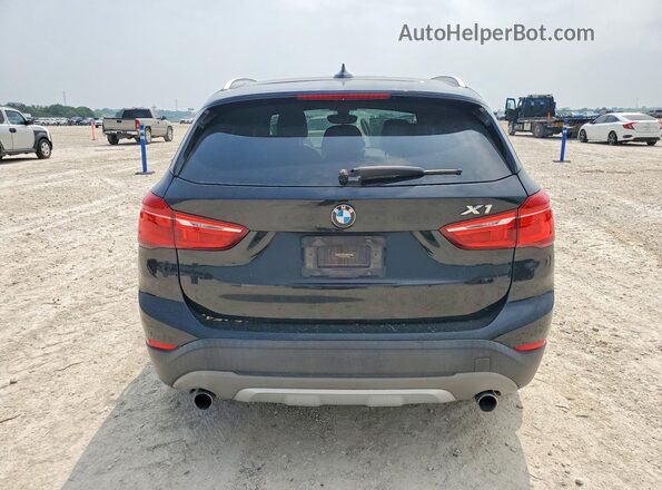 WBXHT3C35H5F75779 2017 BMW X1 Black Հետևի տեսք