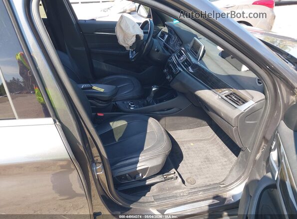 WBXHT3C35H5F81047 2017 BMW X1 Gray Front interior view