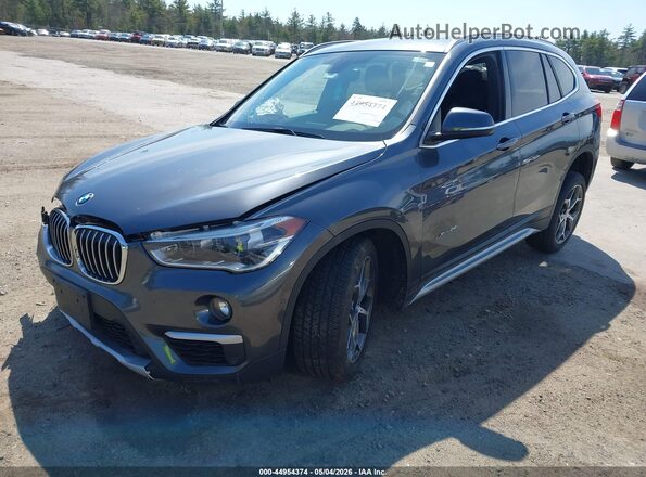 WBXHT3C35H5F81047 2017 BMW X1 Gray Front left