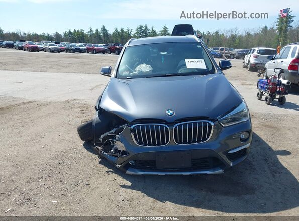 WBXHT3C35H5F81047 2017 BMW X1 Gray Rear interior view