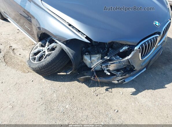 WBXHT3C35H5F81047 2017 BMW X1 Gray Front view