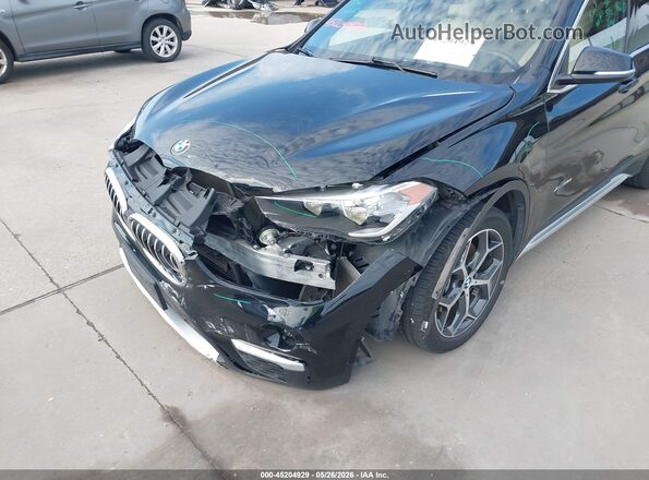 WBXHT3C35J5F89798 2018 BMW X1 Black Front view