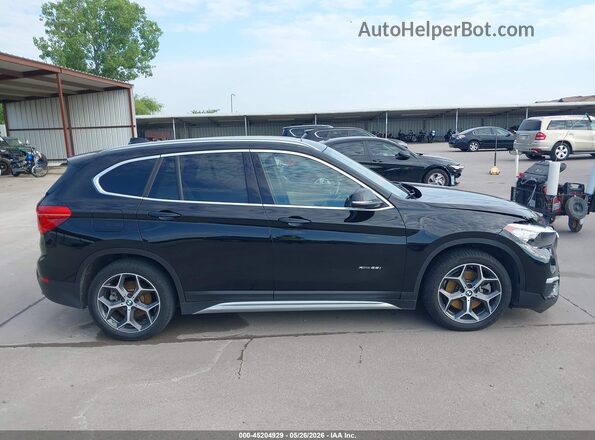 WBXHT3C35J5F89798 2018 BMW X1 Black Rear interior view