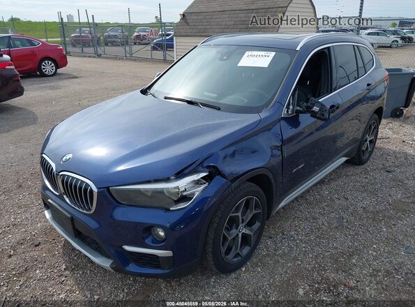 WBXHT3C37H5F71930 2017 BMW X1 Blue Front left
