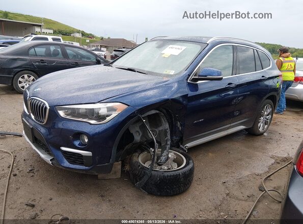WBXHT3C37J5K27520 2018 BMW X1 Blue Vista tres cuartos delantera izquierda