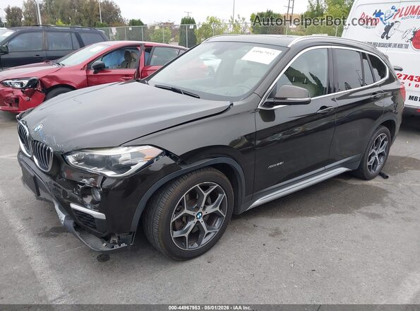 WBXHT3C38G5E55439 2016 BMW X1 Black 