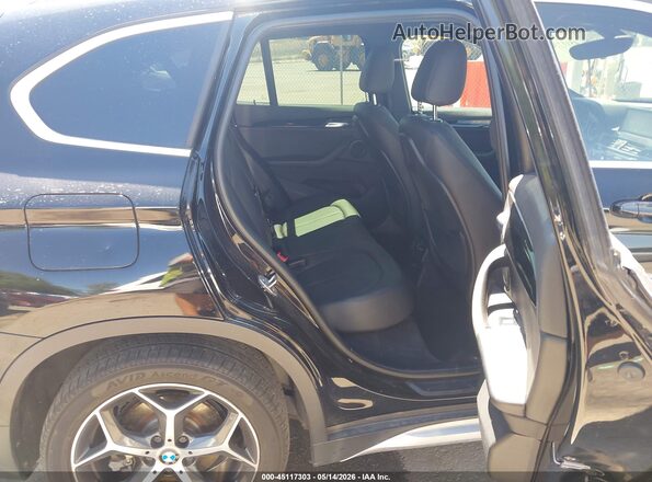 WBXHT3C3XGP884857 2016 BMW X1 Black VIN sticker view
