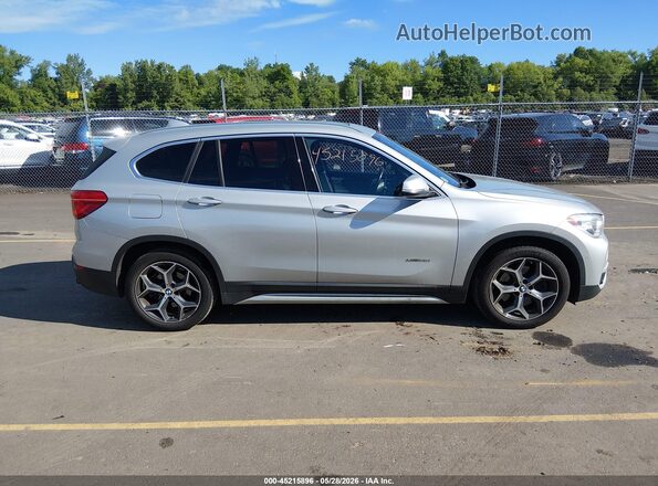 WBXHT3C3XH5F82078 2017 BMW X1 Silver Սալոնի հետևի տեսք