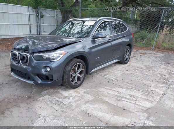 WBXHU7C34J5H40893 2018 BMW X1 Black Front left