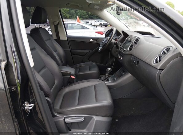 WVGAV7AX0HW502926 2017 VOLKSWAGEN TIGUAN Black Front interior view