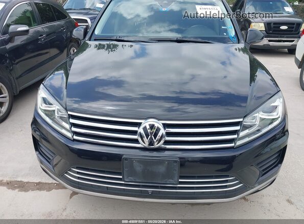WVGEF9BP3GD000592 2016 VOLKSWAGEN TOUAREG Black Front view