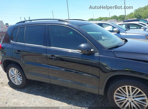 WVGJV7AX9GW030403 2016 VOLKSWAGEN TIGUAN Black Սալոնի հետևի տեսք
