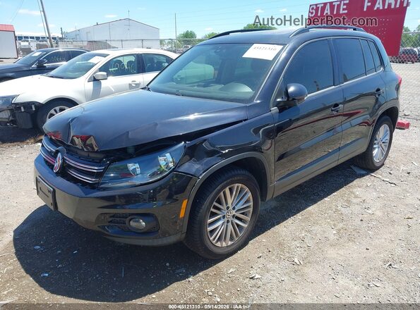 WVGJV7AX9GW030403 2016 VOLKSWAGEN TIGUAN Black Առջևի ձախ երեք քառորդ տեսարան