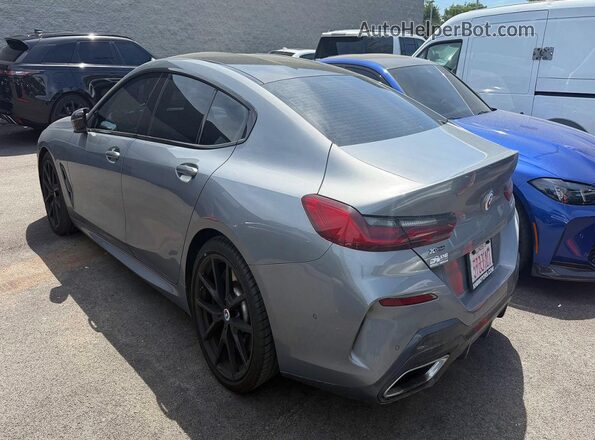 WBAGV8C09PCK90335 2023 BMW M8 Gray Front view