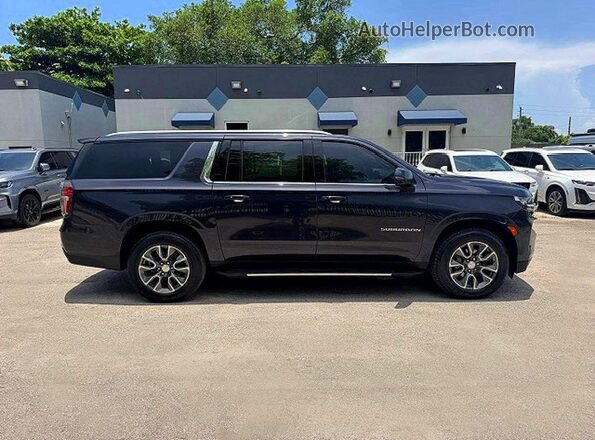 1GNSCCKDXPR303222 2023 CHEVROLET SUBURBAN Gray 360 interior view