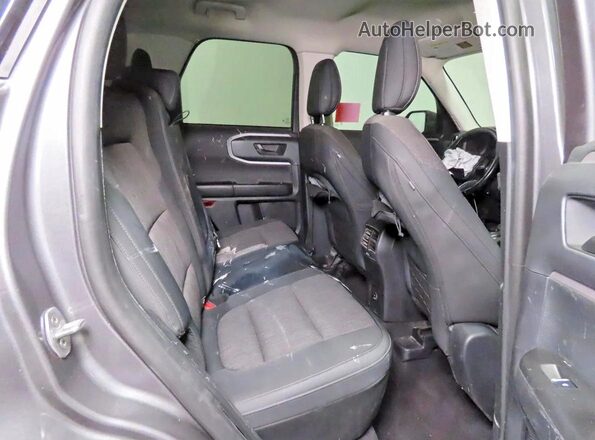 3FMCR9B66PRE04077 2023 FORD BRONCO Серый Вид салона спереди