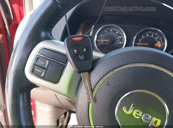 1C4NJCEA2GD699947 2016 JEEP COMPASS Red Widok deski rozdzielczej