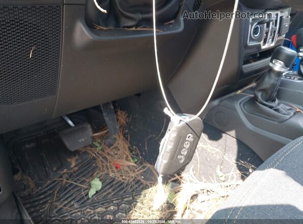 1C4PJXDG7TW213301 2026 JEEP WRANGLER Blue Vista del salpicadero
