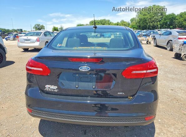 1FADP3H24JL259889 2018 FORD FOCUS Black Rear view