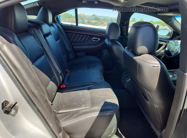 1FAHP2F89GG107580 2016 FORD TAURUS Silver Rear seats view